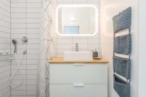 a bathroom with classic white metro tiles