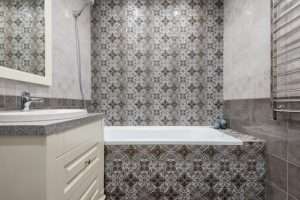 a small bathroom with Moroccan tiles