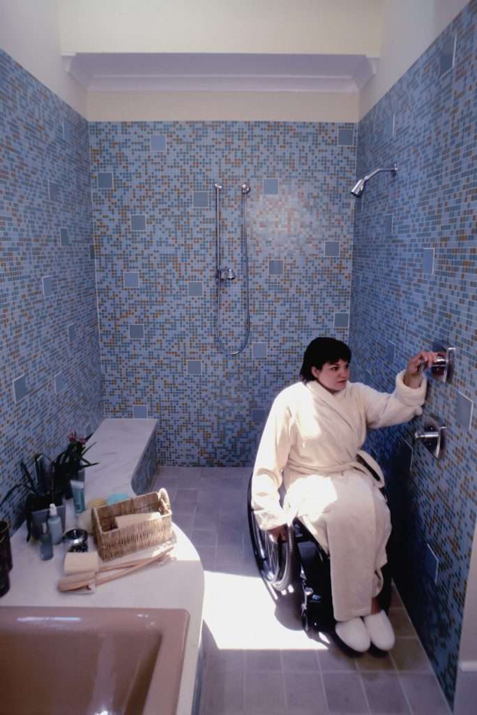Person in a wheelchair using shower